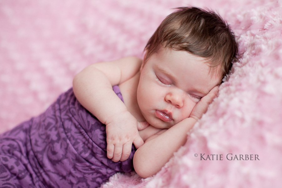 baby girl in purple wrap