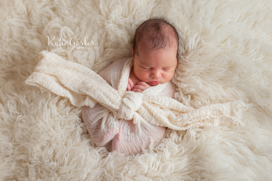 baby in cheesecloth wrap
