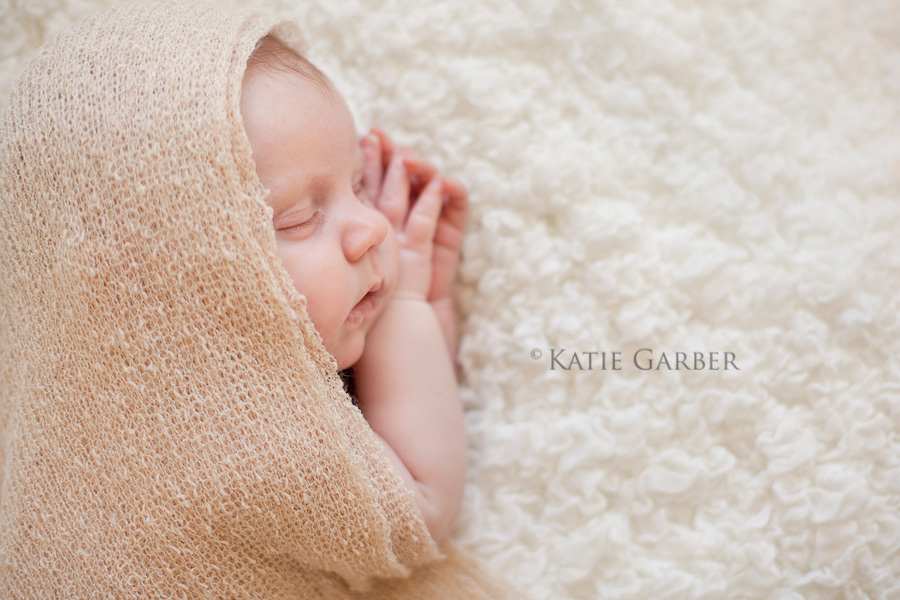newborn baby wearing wrap