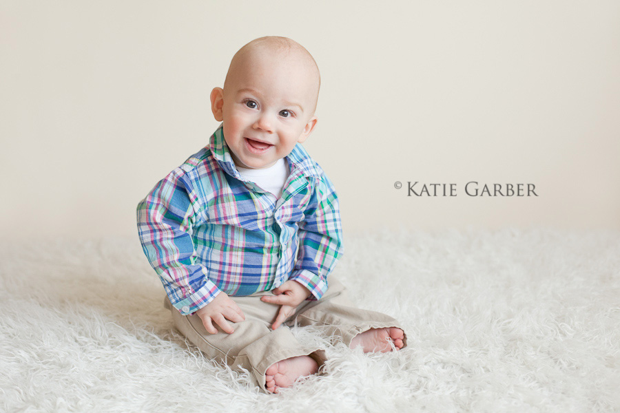smiling baby on furry rug