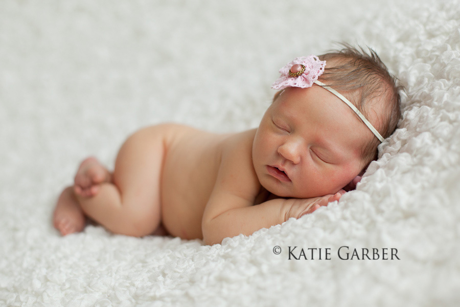 newborn girl with flower headband
