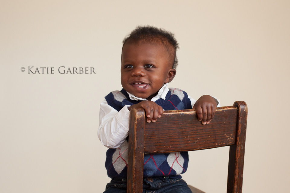 smiling boy on chair