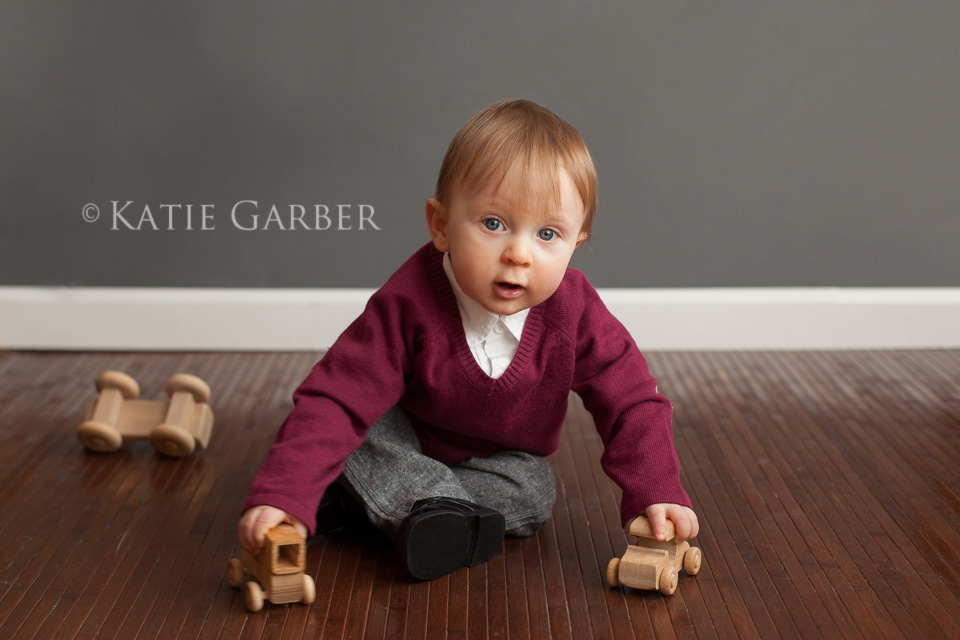 toddler boy playing with cars