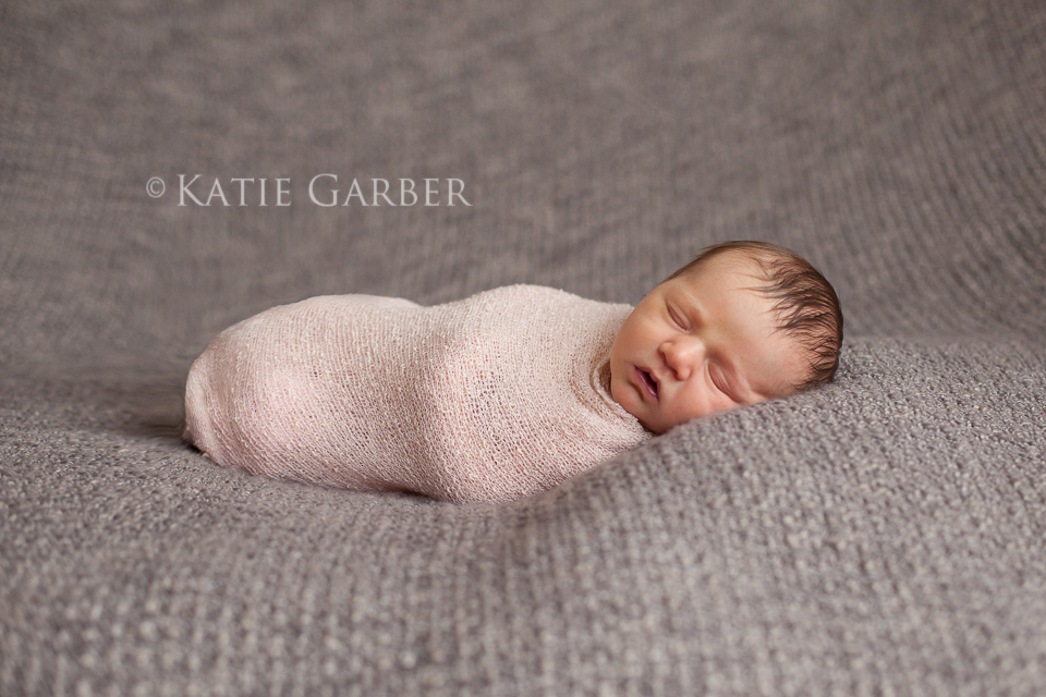 baby girl in stretch wrap