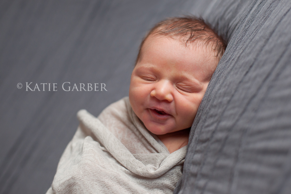 baby girl in swaddle