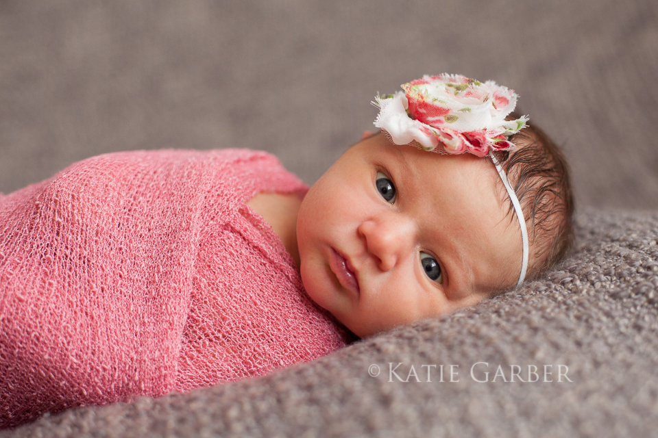 newborn wearing flower headband