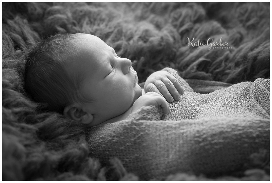 baby boy swaddled flokati