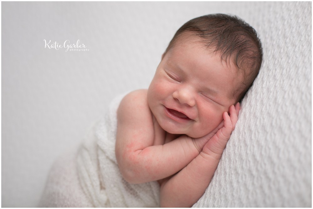 baby boy smiling in sleep