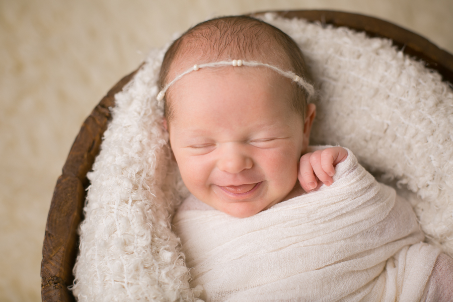 baby girl swaddled bucket